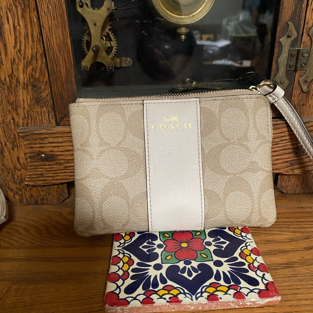 Coach wristlet with cream/white leather stripe